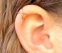 Crossed gold ear cuff